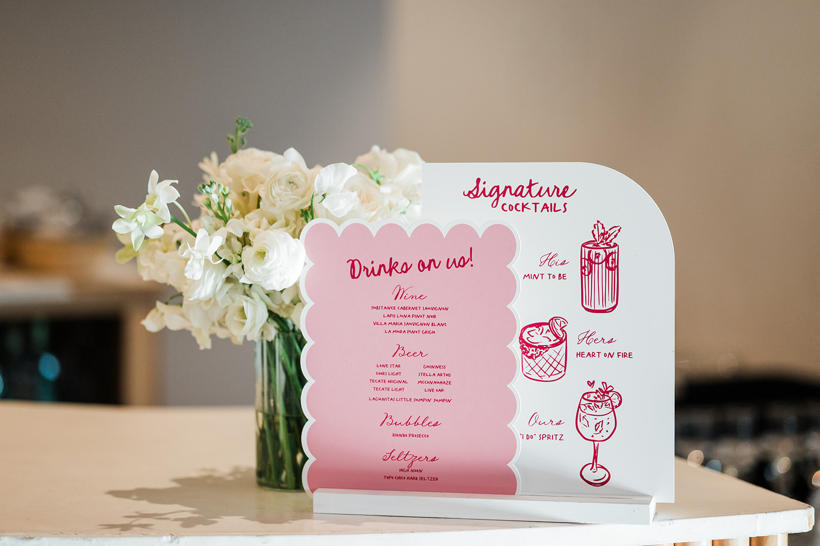 The best wedding signage designer in Austin created this cute pink bar sign